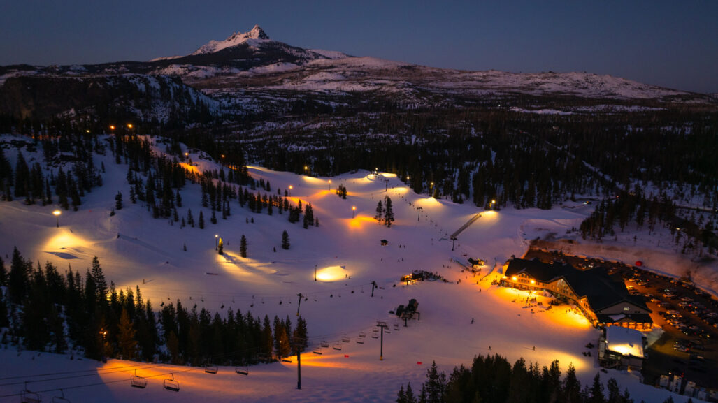 Ski runs lit up at night.