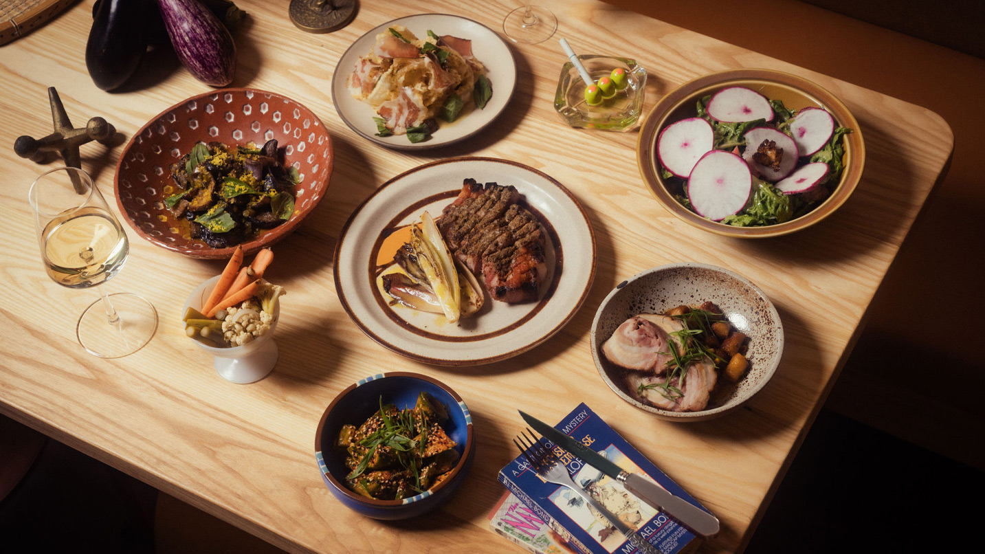 A table full of various dishes of food.