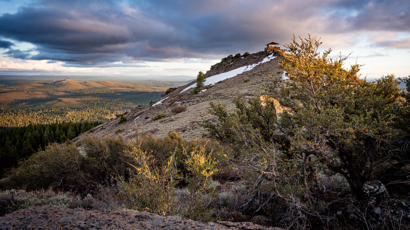 A lookout tower sits at the top of a hill.