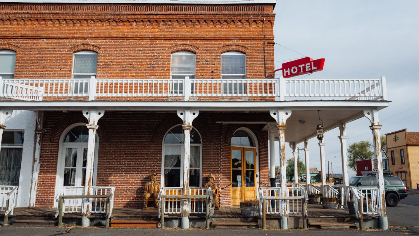 Exterior of a historic brick hotel.