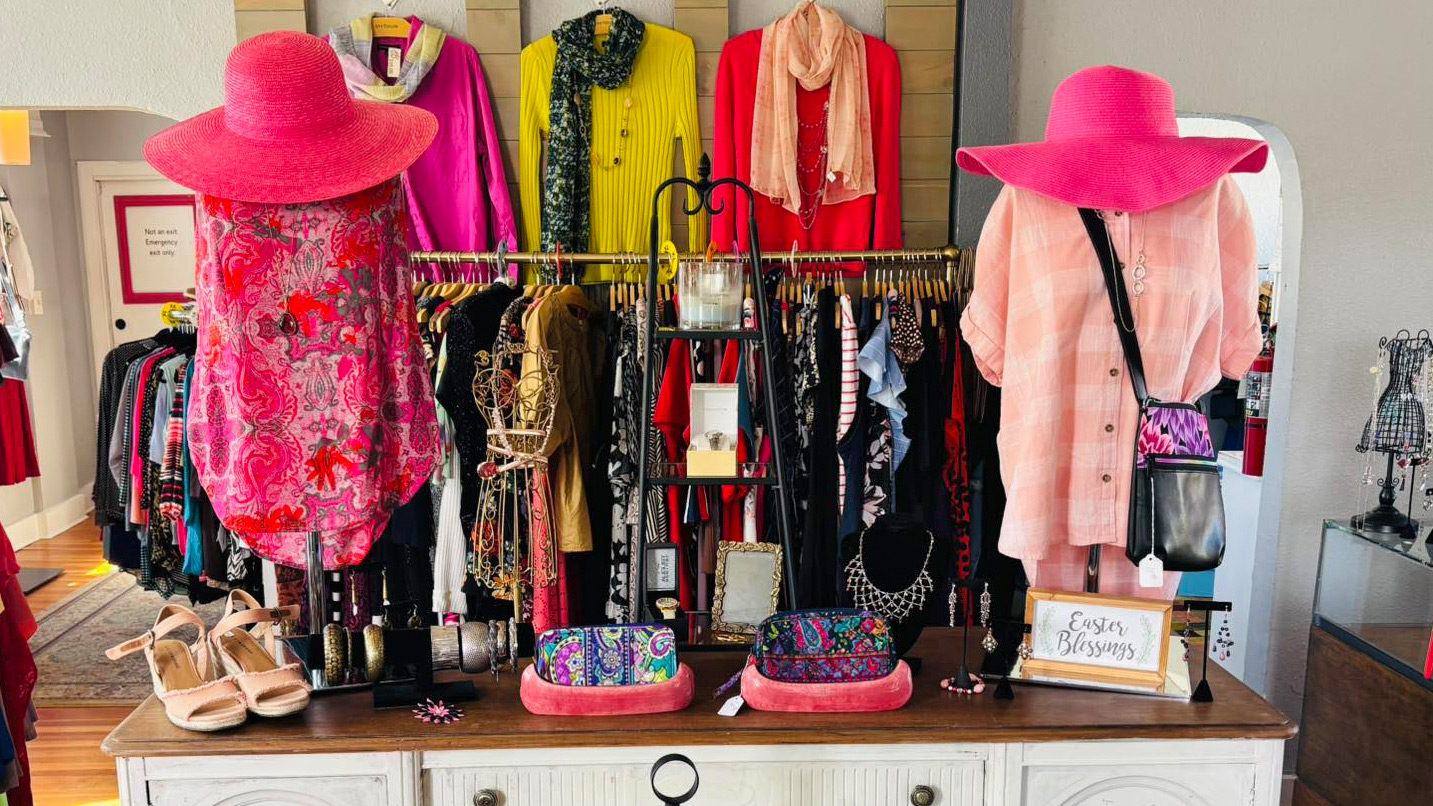 A boutique of carefully arranged vibrant clothing.