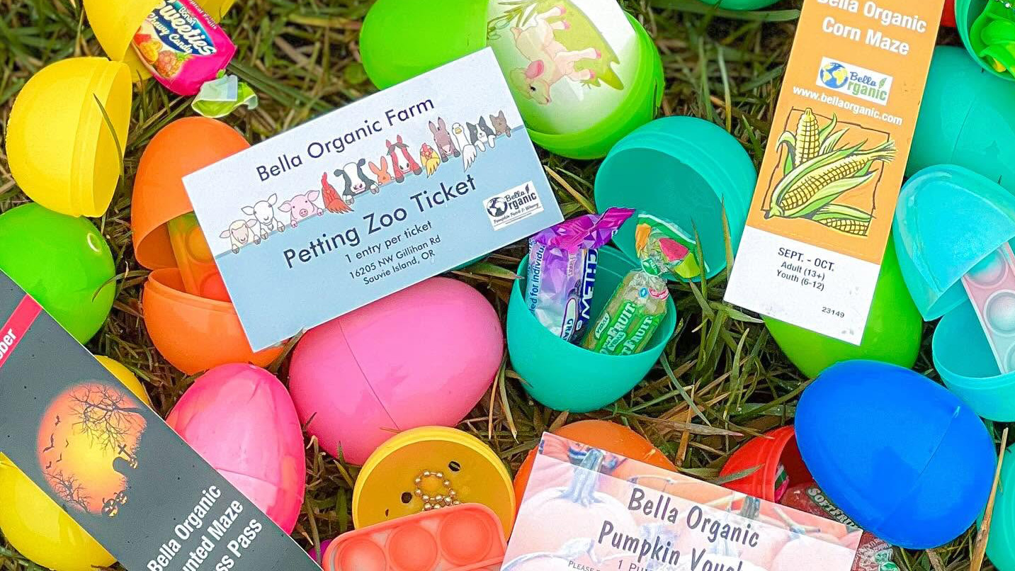 Open plastic eggs show candy and free passes to farm events.