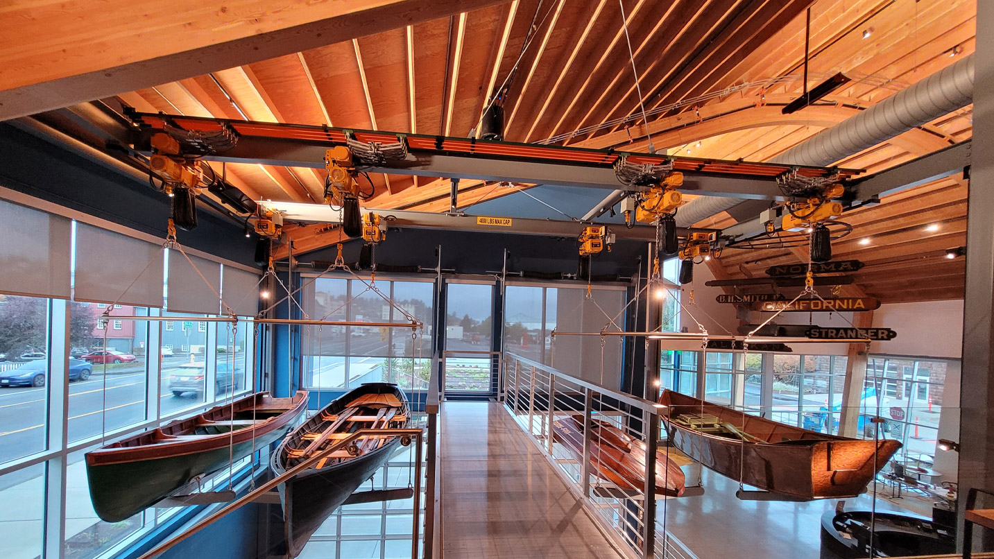 Wooden canoes inside a museum.